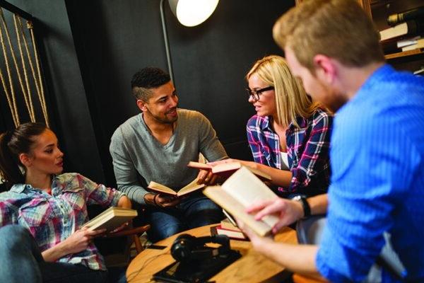 a group of people sitting around a table