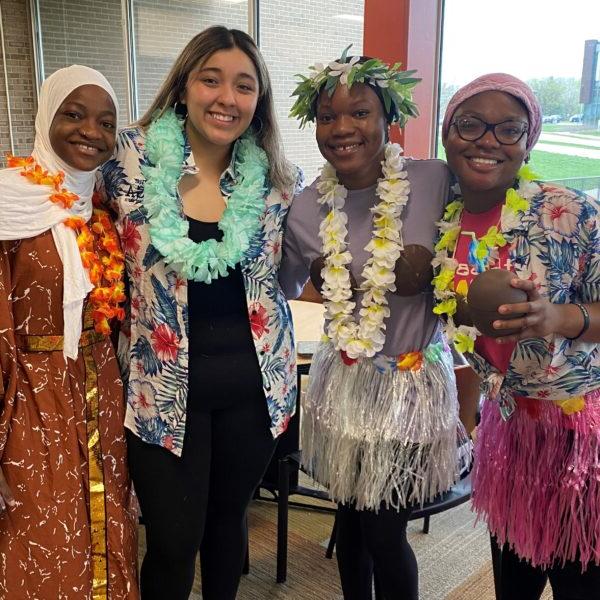 a group of women wearing colorful dresses